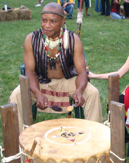 Picture of Max playing the powwow drum at the 2005 Sandusky Ohio powwow